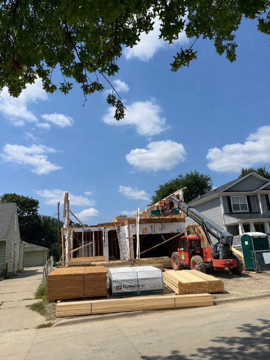 Framing lumber package delivered to the job site ahead of wall framing