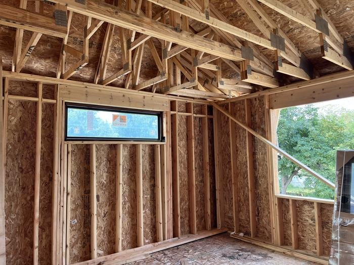 Roof framing and rafters over the upper floor of a new home build in Metro Detroit